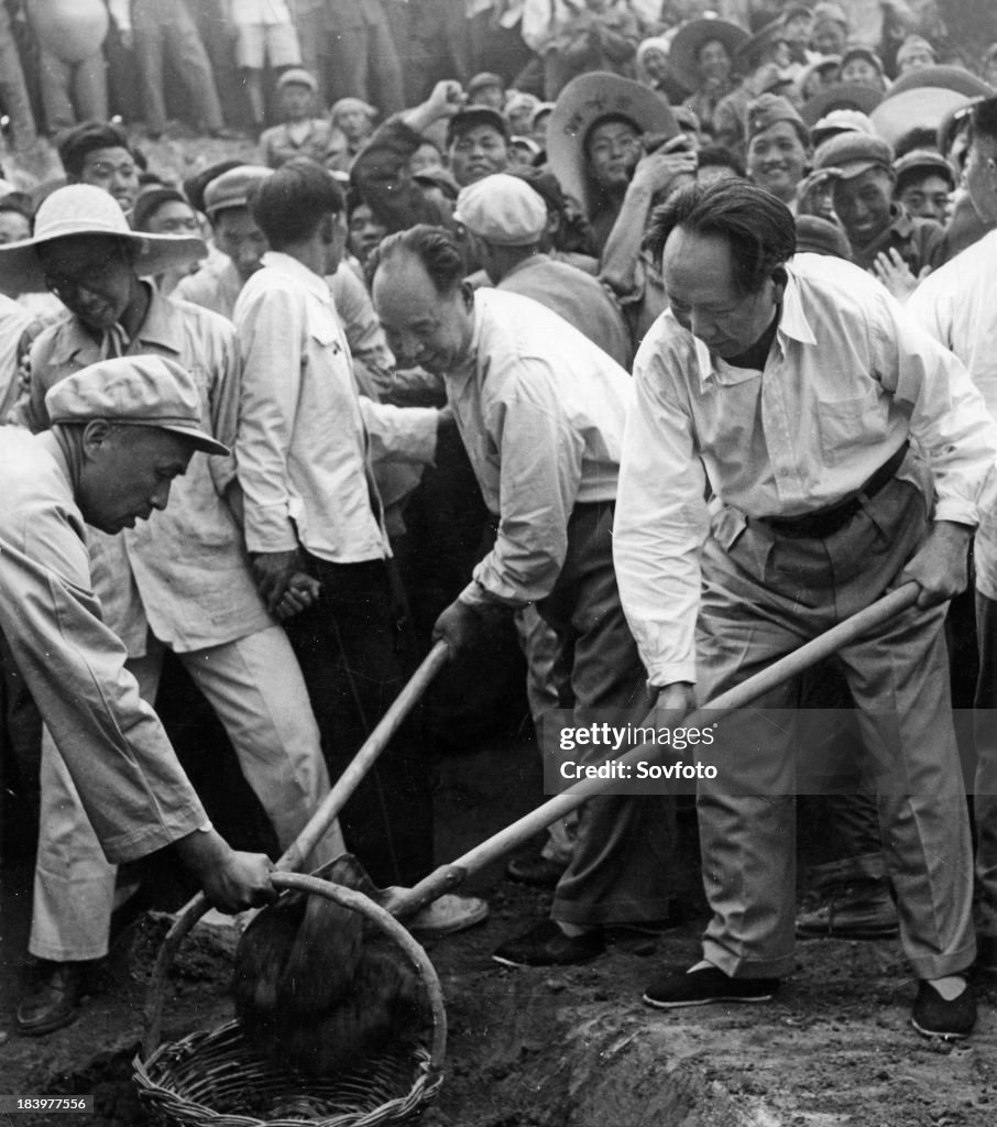 Chairman Mao Zedong and Peng Chen on the construction site of the reservoir at the Ming Tombs near Beijing on May 25, 1958.
