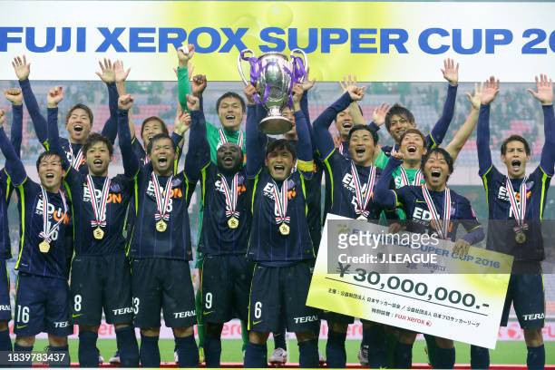 Captain Toshihiro Aoyama of Sanfrecce Hiroshima lifts the trophy at the ceremony after the team's 3-1 victory in the Fuji Xerox Super Cup match...