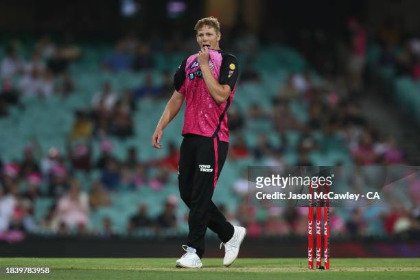 Jack Edwards of the Sixers reacts during the BBL match between Sydney Sixers and Melbourne Renegades at Sydney Cricket Ground on December 08, 2023 in...