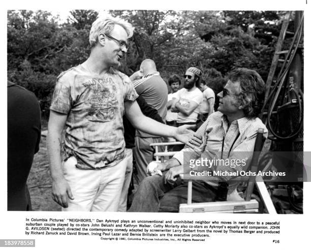 Actor Dan Aykroyd and Director John G. Avildsen on set of the Columbia Pictures movie "Neighbors" in 1981.