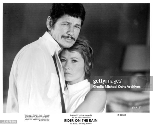 Actor Charles Bronson and Actress Marlene Jobert on set of the Embassy Pictures movie "Rider on the Rain" in 1970.