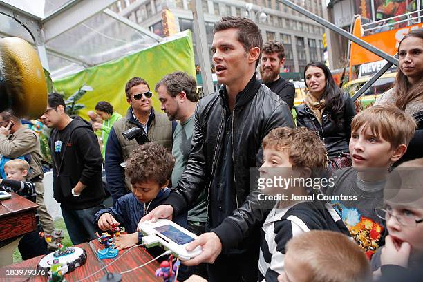 Actor James Marsden plays the new Activision game "Skylanders SWAP Force" during the "SWAPtoberfest" celebration at Pedestrian Plaza in Times Square...