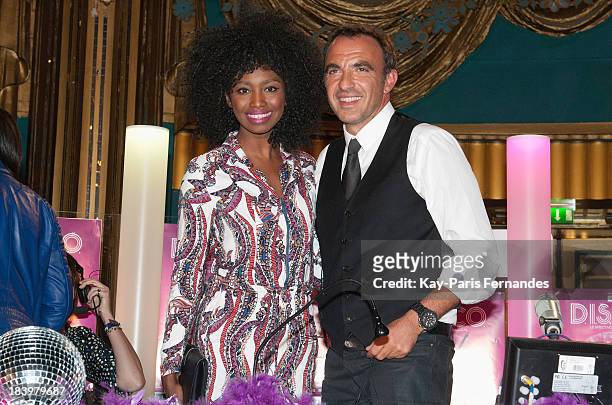 Inna Modja and Nikos Aliagas attend the "Disco" Photo call at the Folies Bergeres on October 10, 2013 in Paris, France.