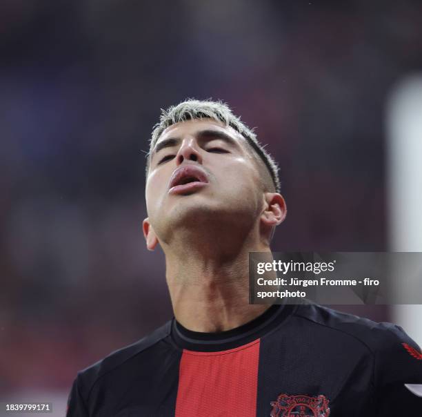 Exequiel Palacios gestures during the Bundesliga match between Bayer 04 Leverkusen and Borussia Dortmund at BayArena on December 3, 2023 in...