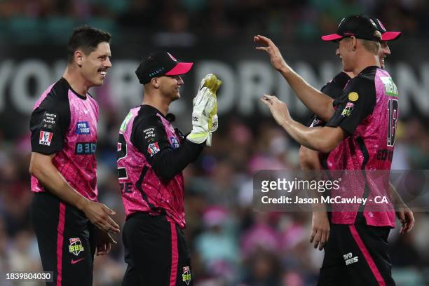 Ben Dwarshuis of the Sixers celebrates after taking the wicket of Jake Fraser-McGurk of the Renegades during the BBL match between Sydney Sixers and...