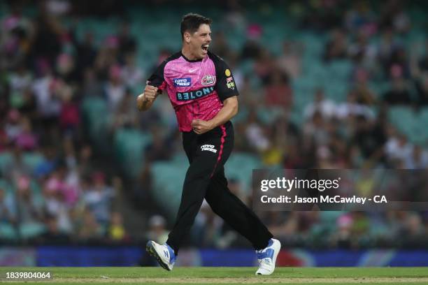 Ben Dwarshuis of the Sixers celebrates after taking the wicket of Jake Fraser-McGurk of the Renegades during the BBL match between Sydney Sixers and...