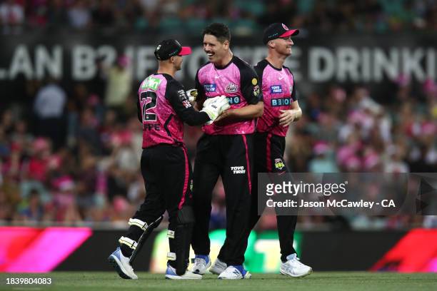 Ben Dwarshuis of the Sixers celebrates after taking the wicket of Jake Fraser-McGurk of the Renegades during the BBL match between Sydney Sixers and...