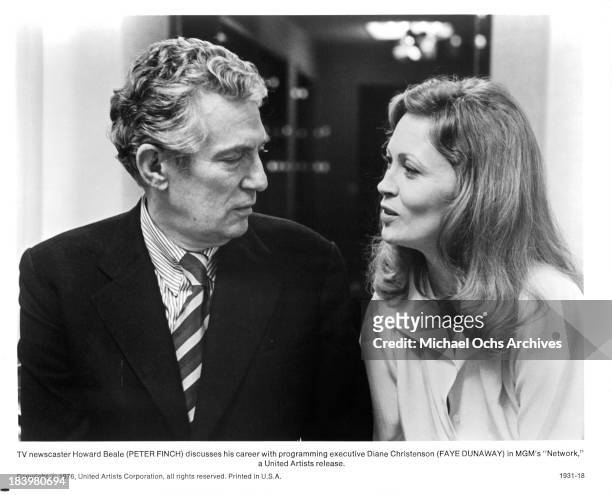 Actor Peter Finch and actress Faye Dunaway on set of the MGM movie "Network" in 1976.