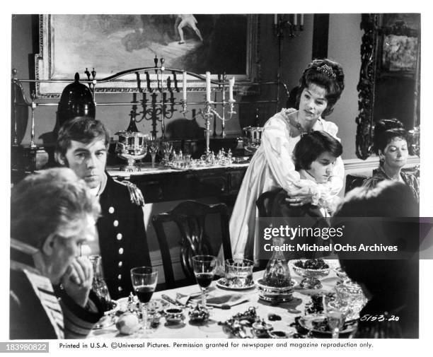 Actor Peter Finch and actress Glenda Jackson with actor Dominic Guard on set of the Universal Studio movie "The Nelson Affair" in 1973.