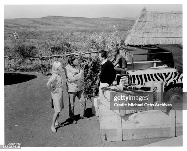 Actress Shirley Eaton, actor Harry Guardino and actor Robert Culp on the set of the movie "Rhino!" in 1964.