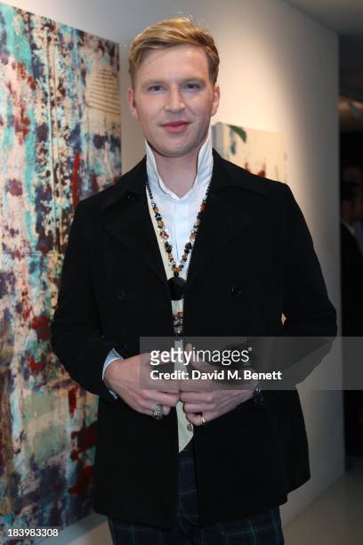Guest attends a private view 'Seize The Day Bed' by artist Billy Zane at Rook & Raven Gallery on October 10, 2013 in London, England.