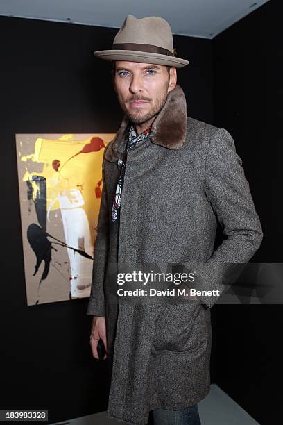 Matt Goss attends a private view 'Seize The Day Bed' by artist Billy Zane at Rook & Raven Gallery on October 10, 2013 in London, England.