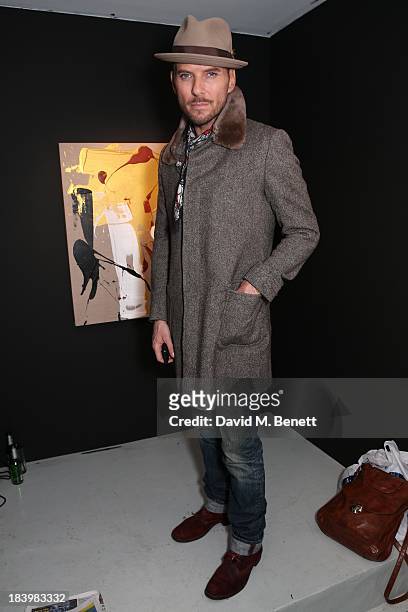 Matt Goss attends a private view 'Seize The Day Bed' by artist Billy Zane at Rook & Raven Gallery on October 10, 2013 in London, England.
