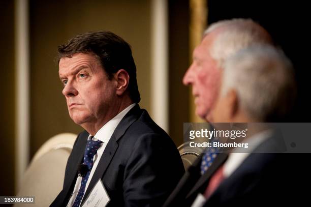 Colm Kelleher, president of institutional securities for Morgan Stanley, left, listens during the 2013 Bretton Woods Committee International Council...
