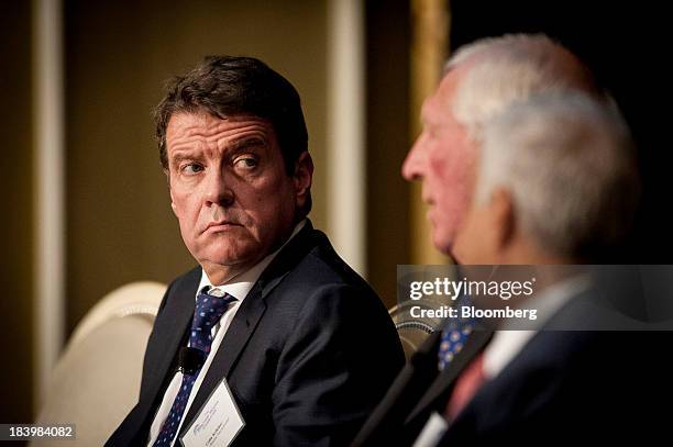 Colm Kelleher, president of institutional securities for Morgan Stanley, left, listens during the 2013 Bretton Woods Committee International Council...