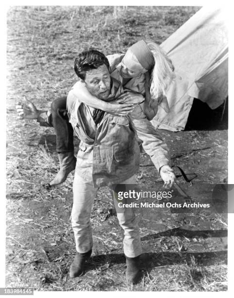 Actor Harry Guardino and actress Shirley Eaton on the set of the movie "Rhino!" in 1964.