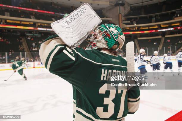 Josh Harding of the Minnesota Wild warms up prior to the game against the Winnipeg Jets on October 10, 2013 at the Xcel Energy Center in St. Paul,...