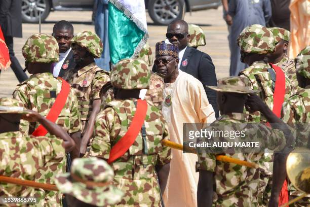 Nigerian President Bola Tinubu arrives at the Airforce Base in Maiduguri on December 11, 2023 for the start of the Chief of Army Staff's Annual...