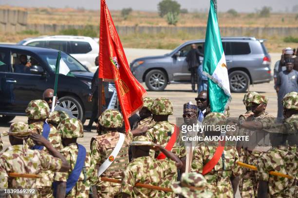 Nigerian President Bola Tinubu arrives at the Airforce Base in Maiduguri on December 11, 2023 for the start of the Chief of Army Staff's Annual...