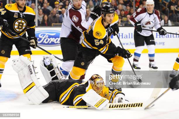 Tuukka Rask of the Boston Bruins dives to make a save against the Colorado Avalanche at the TD Garden on October 10, 2013 in Boston, Massachusetts.