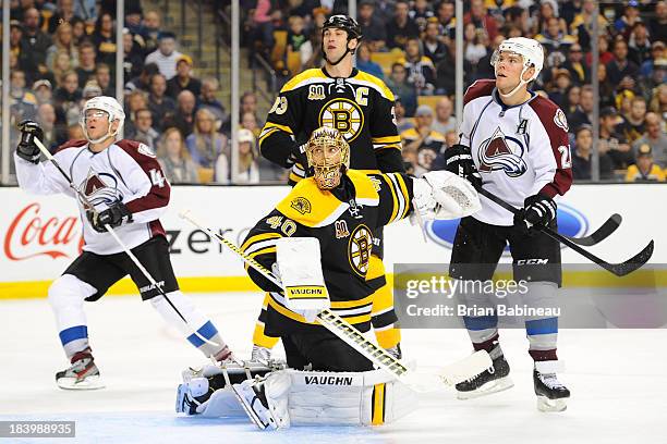 Tuukka Rask of the Boston Bruins looks up at the loose puck against the Colorado Avalanche at the TD Garden on October 10, 2013 in Boston,...