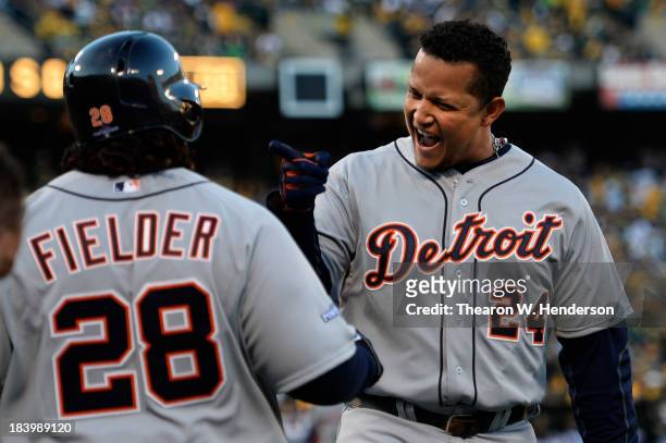 Miguel Cabrera celebrates his two-run home run with Prince Fielder of the Detroit Tigers in the fourth inning against the Oakland Athletics during...