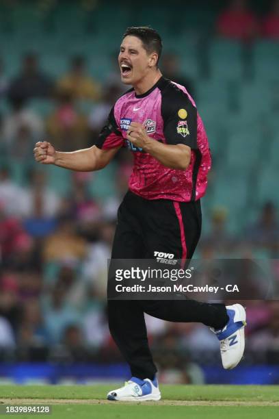 Ben Dwarshuis of the Sixers celebrates after taking the wicket of Tom Rogers of the Renegades during the BBL match between Sydney Sixers and...