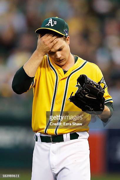 Sonny Gray of the Oakland Athletics reacts after giving up a single to Jhonny Peralta of the Detroit Tigers in the fourth inning during Game Five of...
