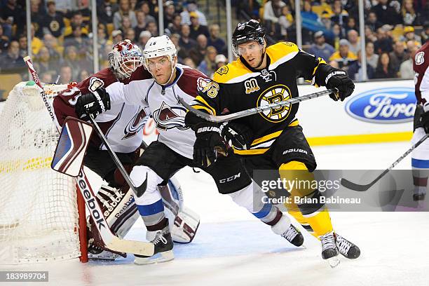 David Krejci of the Boston Bruins skates against Paul Stastney of the Colorado Avalanche at the TD Garden on October 10, 2013 in Boston,...