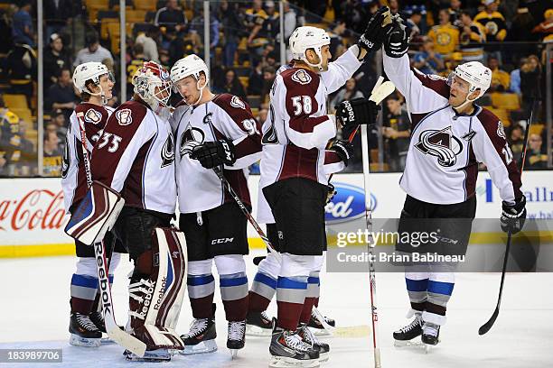 Players of the Colorado Avalanche celebrate a win against the Boston Bruins at the TD Garden on October 10, 2013 in Boston, Massachusetts.
