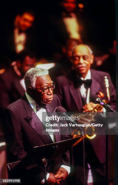 At the Jazz at Lincoln Center's 'An Evening With Benny Carter' concert, American baritone Jazz and Blues singer Joe Williams performs with musician...