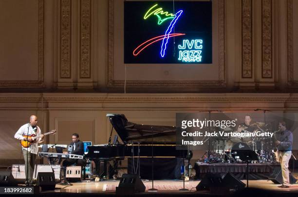 American Jazz composer and musician Herbie Hancock leads his band from the piano and keyboards with, from left, Beninese guitarist Lionel Loueke,...