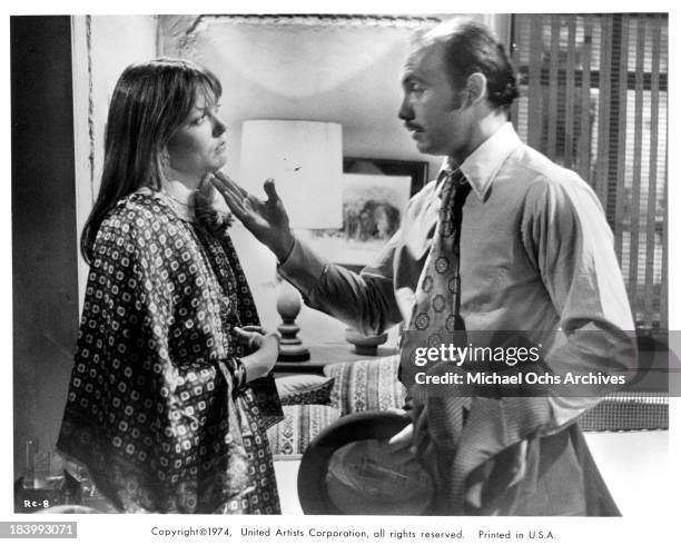 Actress Susan Blakely and actor Hector Elizondo on set of the United Artists movie "Report to the Commissioner" in 1975.