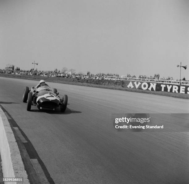 Racing driver Stirling Moss in his Cooper T43 Climax car during the BRDC International Trophy Race, Silverstone circuit, Northamptonshire, May 3rd...