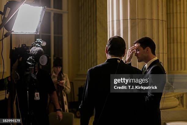 Democrat Representative Jim Himes , appears on a live CNN interview with Republican Representative Tom Cole as congressional staff continue...