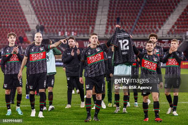 Players of NEC celebrate the win with the shirt of Bas Dost of NEC during the Dutch Eredivisie match between AZ and NEC, a continuation of a game...