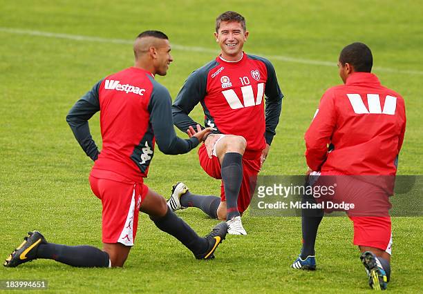 Patrick Kisnorbo talks with Harry Kewell and Patrick Gerhardt during a Melbourne Heart A-League training session at Epping Stadium on October 11,...