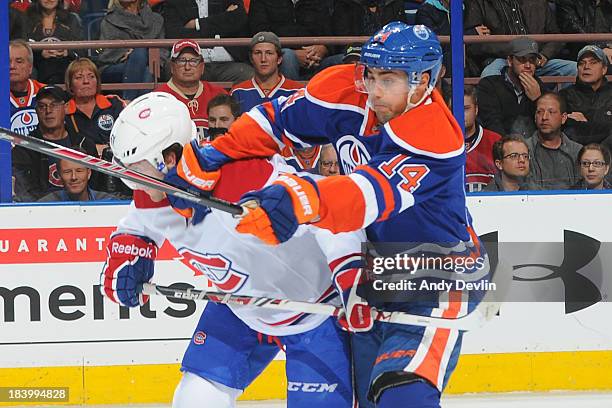 Jordan Eberle of the Edmonton Oilers battles against the Montreal Canadiens on October 10, 2013 at Rexall Place in Edmonton, Alberta, Canada.