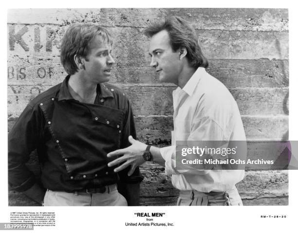 Actors John Ritter and James Belushi on the set of the United movie "Real Men" in 1987.