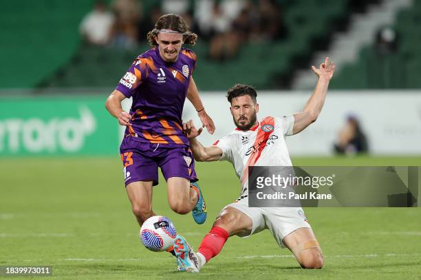 Daniel Bennie of the Glory is challenged by Mathew Leckie of Melbourne City during the A-League Men round seven match between Perth Glory and...