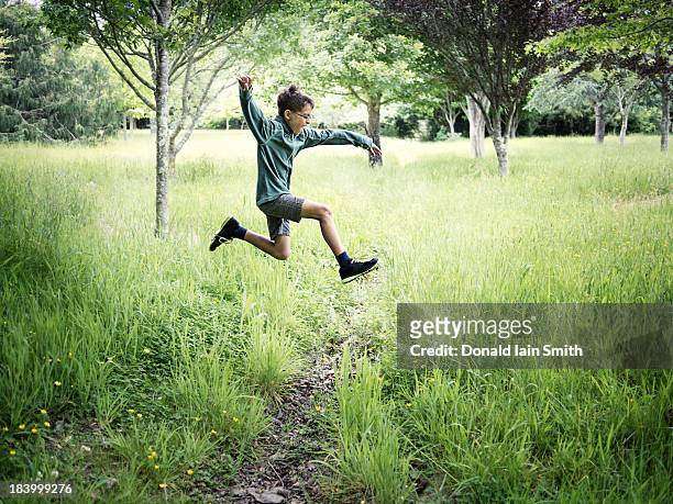 jump - boys running stock pictures, royalty-free photos & images