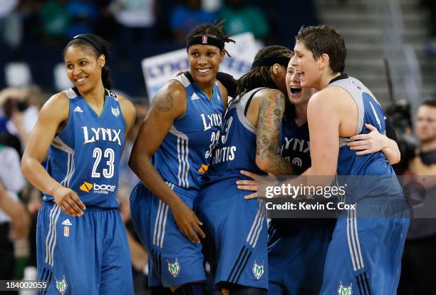 Maya Moore, Rebekkah Brunson, Seimone Augustus, Lindsay Whalen, and Janel McCarville of the Minnesota Lynx celebrate in the final seconds of their...