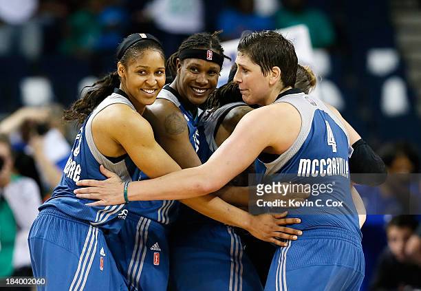 Maya Moore, Rebekkah Brunson, Seimone Augustus, Lindsay Whalen, and Janel McCarville of the Minnesota Lynx celebrate in the final seconds of their...