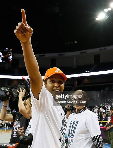 Glen Taylor, owner of the Minnesota Lynx, congratulates Maya Moore after their 86-77 win over the Atlanta Dream in Game Three of the 2013 WNBA Finals...