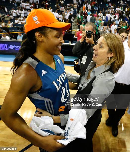 Head coach Cheryl Reeve of the Minnesota Lynx hugs Maya Moore after their 86-77 win over the Atlanta Dream in Game Three of the 2013 WNBA Finals at...