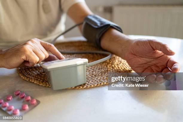 blood pressure measurement - hypertensive stock pictures, royalty-free photos & images