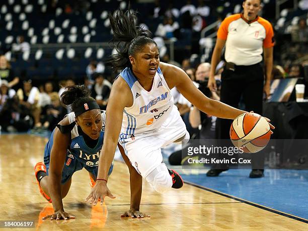Alex Bentley of the Atlanta Dream steals the ball from Monica Wright of the Minnesota Lynx during Game Three of the 2013 WNBA Finals at Philips Arena...