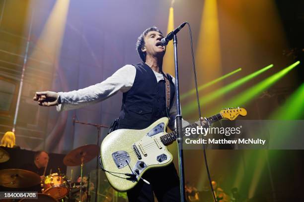 Johnny Marr performs during A Night With The Johnny Marr Orchestra at Factory International on December 07, 2023 in Manchester, England.