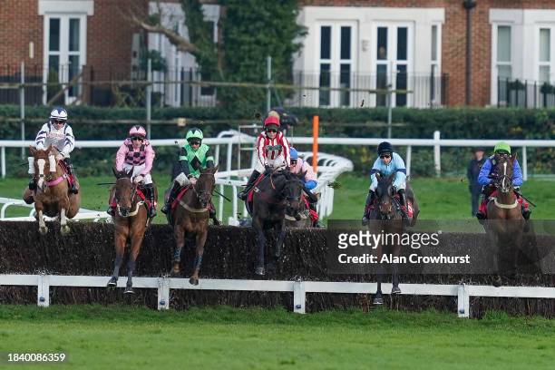 General view as runners take the first fence during The Best Odds On The Betfair Exchange Handicap Chase at Sandown Park Racecourse on December 08,...