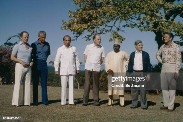 Leaders of seven countries posing for a photo during a conference on bridging the economic gulf between rich and poor nations, Runaway Bay, Jamaica,...